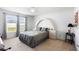 Bedroom featuring a bed with a unique headboard and bedside tables, bathed in natural light at 4529 Orchard Grove Rd, St Cloud, FL 34772