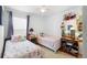 Bedroom with two twin beds and decor, offering a cozy and inviting atmosphere at 4529 Orchard Grove Rd, St Cloud, FL 34772