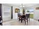 Cozy dining room with tile floors and a sliding glass door to the backyard at 4529 Orchard Grove Rd, St Cloud, FL 34772