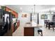 Charming kitchen with granite counters, pendant lighting, and open access to the dining area at 4529 Orchard Grove Rd, St Cloud, FL 34772