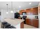 Bright kitchen features a large island with seating, black appliances, and attractive cabinetry at 4529 Orchard Grove Rd, St Cloud, FL 34772