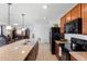 This spacious kitchen features granite countertops, an island, and updated stainless steel appliances at 4529 Orchard Grove Rd, St Cloud, FL 34772