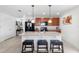 Modern kitchen featuring a breakfast bar with seating and stainless steel appliances at 4529 Orchard Grove Rd, St Cloud, FL 34772