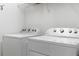 Laundry room with a washer and a dryer for efficient laundry tasks at 4529 Orchard Grove Rd, St Cloud, FL 34772