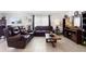 The comfortable living room features abundant seating, natural light, and stylish décor at 4529 Orchard Grove Rd, St Cloud, FL 34772