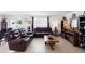 The comfortable living room offers ample seating, natural light, and a modern entertainment center at 4529 Orchard Grove Rd, St Cloud, FL 34772