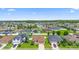 Well-maintained neighborhood with homes featuring manicured lawns and mature trees at 4529 Orchard Grove Rd, St Cloud, FL 34772
