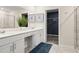 Bright bathroom with double vanity, walk-in closet, and modern fixtures at 4693 Golden Knight Blvd, Kissimmee, FL 34746