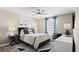 Comfortable bedroom with stylish decor, patterned rug, and bright natural light at 4693 Golden Knight Blvd, Kissimmee, FL 34746