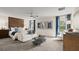 Spacious living area with modern furniture, art, and views from bright windows at 4693 Golden Knight Blvd, Kissimmee, FL 34746