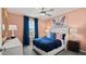 Inviting bedroom with a plush bed, soft lighting, and a serene ambiance at 4693 Golden Knight Blvd, Kissimmee, FL 34746