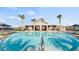A refreshing pool with a covered outdoor clubhouse area perfect for relaxation and socializing at 4693 Golden Knight Blvd, Kissimmee, FL 34746