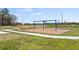 Neighborhood park and playground with benches and swings amid landscaped greenery at 4694 Golden Knight Blvd, Kissimmee, FL 34746