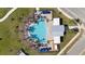 Aerial view of a community pool with lounge chairs, umbrellas, and palm trees at 4694 Golden Knight Blvd, Kissimmee, FL 34746