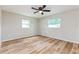 Light-filled bedroom showcasing new floors, neutral walls, and two windows for ample natural light at 5021 Saint Marie Ave, Belle Isle, FL 32812