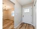 Inviting entryway with a view into the spacious living area and front door at 5021 Saint Marie Ave, Belle Isle, FL 32812