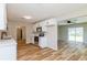 Bright kitchen features white cabinets, stainless steel appliances, and light countertops at 5021 Saint Marie Ave, Belle Isle, FL 32812