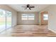 Spacious living room featuring sliding glass doors and windows for ample natural light at 5021 Saint Marie Ave, Belle Isle, FL 32812