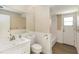 Bathroom featuring beadboard wall and vanity, bathtub/shower, and direct access to outside at 5057 Maui Cir # 15, Orlando, FL 32808