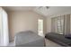Bedroom with two beds, neutral decor and access to ensuite bathroom at 5057 Maui Cir # 15, Orlando, FL 32808