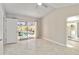 Bedroom view showing sliding glass doors to the pool and full bathroom access at 5057 Maui Cir # 15, Orlando, FL 32808