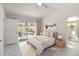 Bright bedroom with pool view, en-suite bathroom, and modern furnishings at 5057 Maui Cir # 15, Orlando, FL 32808