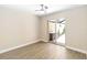 Bedroom with sliding glass doors offering access to a private patio and hot tub at 5057 Maui Cir # 15, Orlando, FL 32808