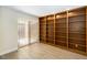 Spacious bedroom with wood floors, sliding glass doors, and a built in bookshelf at 5057 Maui Cir # 15, Orlando, FL 32808