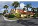 Beautiful corner lot featuring lush tropical landscaping and mature palm trees at 5057 Maui Cir # 15, Orlando, FL 32808