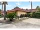 Charming home with a red tile roof, mature landscaping, and a well-maintained driveway at 5057 Maui Cir # 15, Orlando, FL 32808