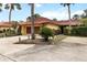Beautiful one-story home with tile roof, paver driveway, and lush tropical landscaping creating curb appeal at 5057 Maui Cir # 15, Orlando, FL 32808
