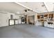 Spacious garage featuring laundry area, work bench, and white walls at 5057 Maui Cir # 15, Orlando, FL 32808