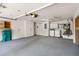 Well-organized garage featuring storage cabinets and laundry area at 5057 Maui Cir # 15, Orlando, FL 32808