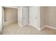 Hallway with tile flooring, neutral paint, and doors leading to other rooms at 5057 Maui Cir # 15, Orlando, FL 32808