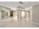Spacious living room with tile floors, fireplace, and sliding glass doors to outdoor space at 5057 Maui Cir # 15, Orlando, FL 32808