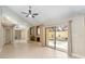 Bright living room with mirrored wall, brick fireplace and view to the screened-in pool at 5057 Maui Cir # 15, Orlando, FL 32808