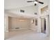 Open living room with tile floors, vaulted ceilings, and sliding glass doors to the patio at 5057 Maui Cir # 15, Orlando, FL 32808
