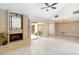 Living room featuring a brick fireplace and access to a screened-in outdoor space at 5057 Maui Cir # 15, Orlando, FL 32808