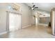 Bright living room with tile floors, vaulted ceilings, and sliding glass doors at 5057 Maui Cir # 15, Orlando, FL 32808