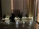 Cozy patio illuminated by landscape lighting and adorned with garden plants at 5057 Maui Cir # 15, Orlando, FL 32808