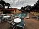 Relaxing community pool and patio with comfortable seating, creating a serene environment for leisure and enjoyment at 5057 Maui Cir # 15, Orlando, FL 32808