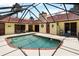 Secluded outdoor pool area with a screened enclosure, offering a private oasis for relaxation and recreation at 5057 Maui Cir # 15, Orlando, FL 32808
