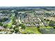 Scenic aerial view of a residential community featuring lush landscaping and golf course at 519 Cadiz Dr, Davenport, FL 33837
