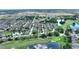 Scenic aerial view of a community near a golf course and ponds, perfect for outdoor living at 519 Cadiz Dr, Davenport, FL 33837