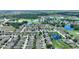 Picturesque aerial of a well-maintained community with a golf course and serene ponds at 519 Cadiz Dr, Davenport, FL 33837