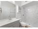 Clean bathroom with walk-in shower and a gray vanity with a white vessel sink at 519 Cadiz Dr, Davenport, FL 33837