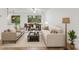 Bright living room features a dining area, comfortable seating, and abundant natural light from large windows at 519 Cadiz Dr, Davenport, FL 33837