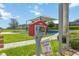 View of a community free little library with various books and a community playground nearby at 5627 Orange Orchard Dr, Winter Garden, FL 34787