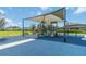 Outdoor playground with covered play structure, equipment, and benches within a community park at 5627 Orange Orchard Dr, Winter Garden, FL 34787