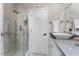 Updated bathroom boasts a glass-enclosed shower, modern fixtures, and a stylish vanity at 5801 Marleon Drive Marleon Drive, Windermere, FL 34786